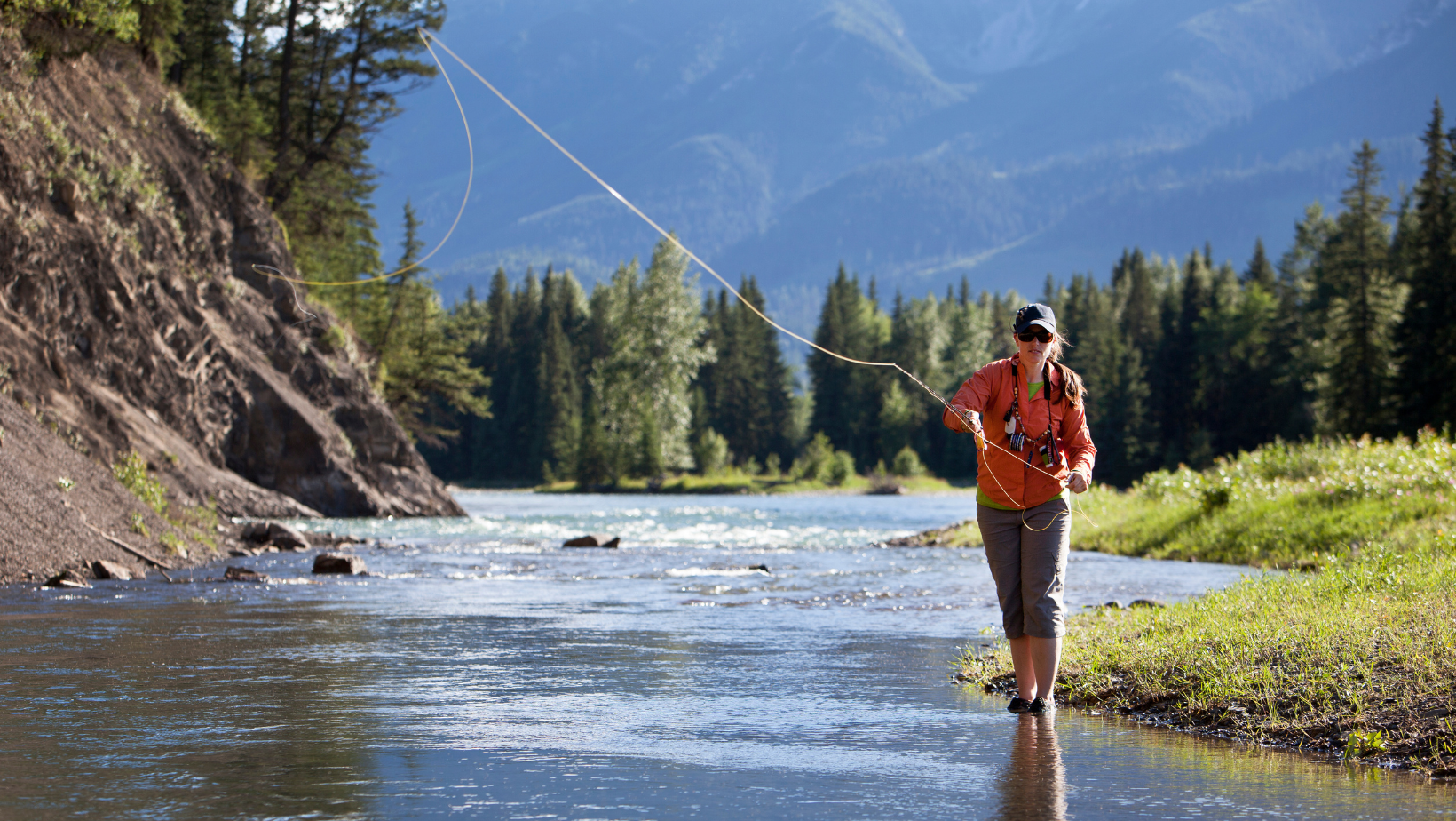 Woman fly fishing