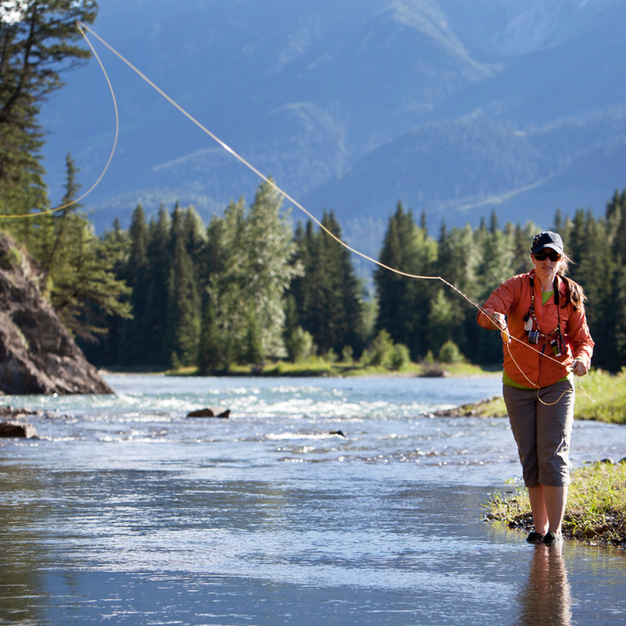 Woman fly fishing
