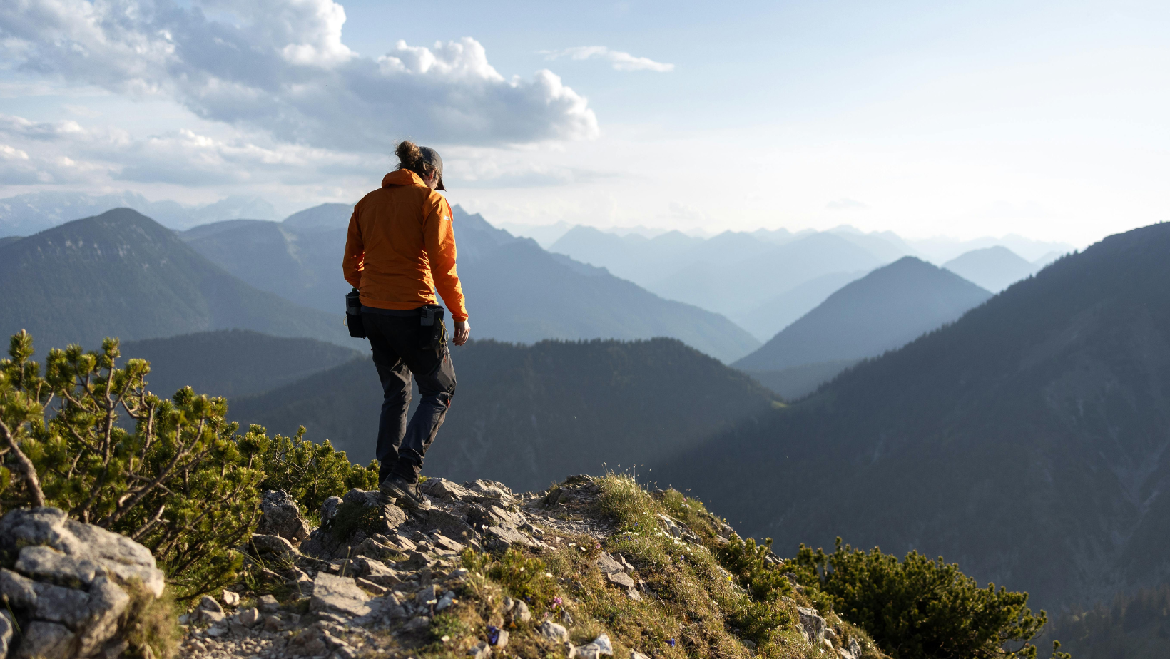 Solo hiker atop a mountain