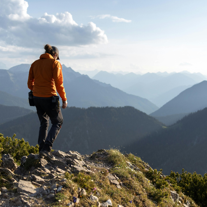 Solo hiker atop a mountain