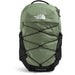 The North Face Borealis backpack in sage green and black, featuring a top handle, zippered compartments, and a crisscross bungee cord system on the front, set against a plain white background.