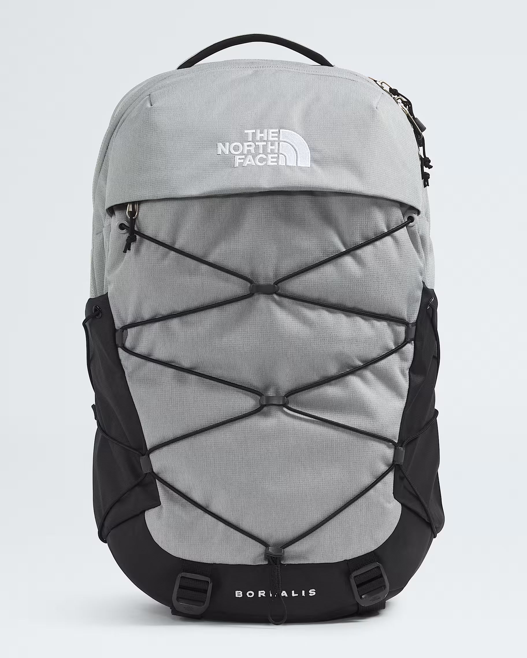 The North Face Borealis backpack in gray and black, featuring a front zippered pocket with crisscross compression straps, a top carry handle, and a white The North Face logo on the upper front.