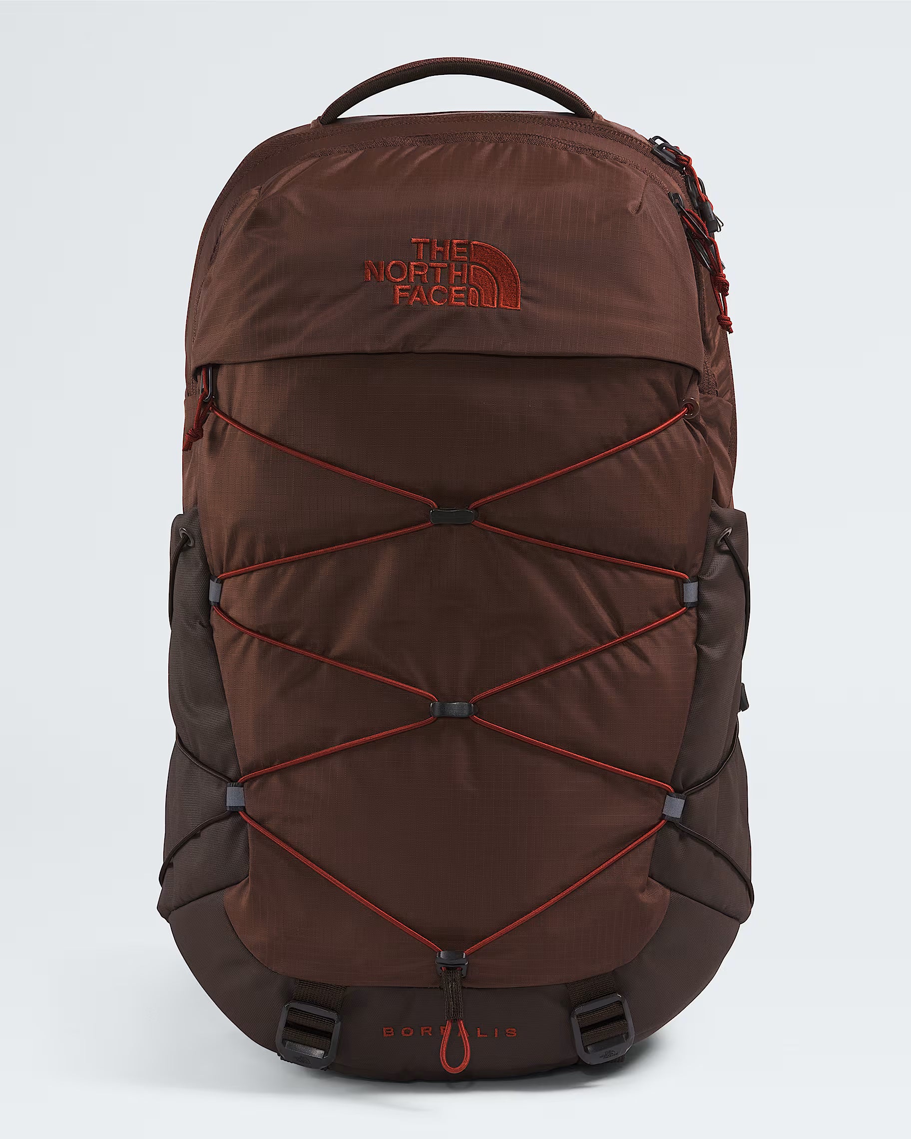 The North Face Gokil 13 backpack in brown with red accents, including the brand logo and compression straps, shown against a light gray background.